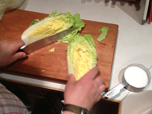 nappa cabbage being cut in half 