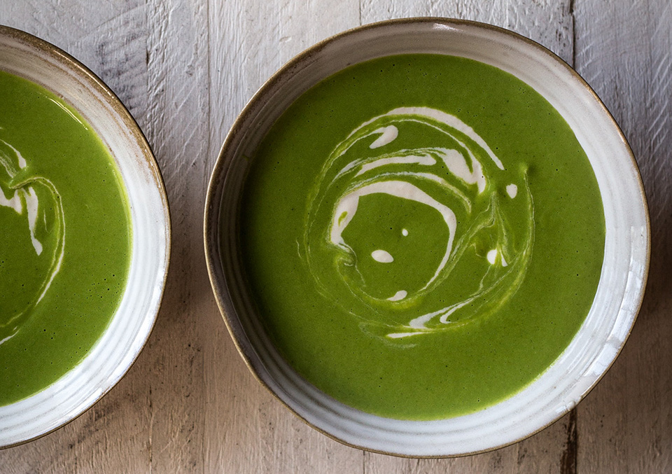 Bowl of Minty Pea Soup with Green Garlic & Cashew Cream